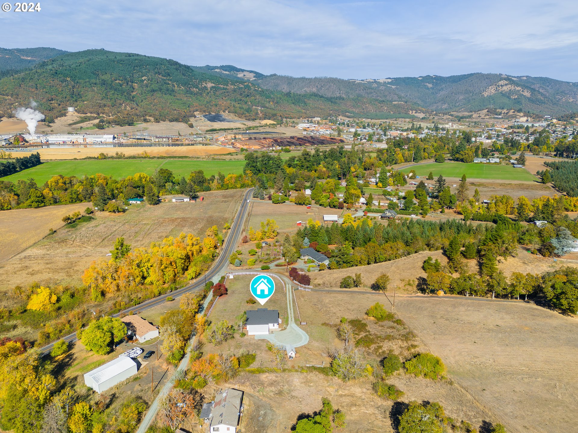 754 Glenbrook Loop Road Riddle, OR 97469 - Photo 42 of 45 a view of an ocean with a mountain