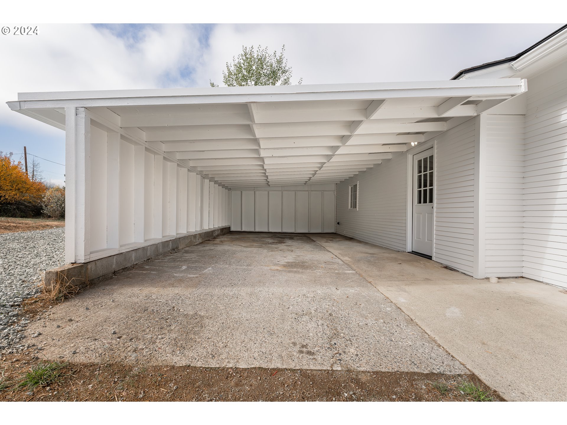 754 Glenbrook Loop Road Riddle, OR 97469 - Photo 5 of 45 a view of a room with a wooden floor