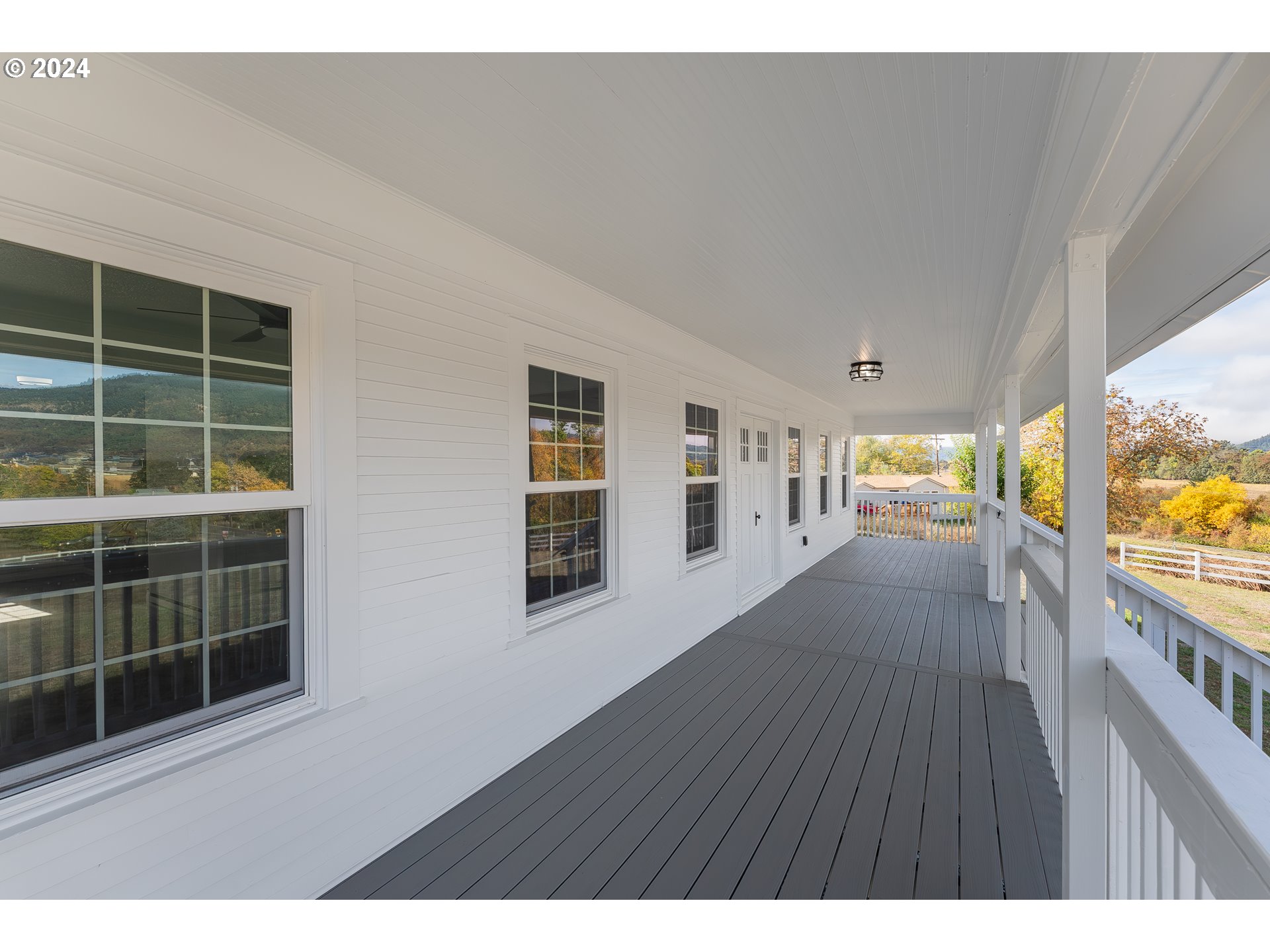 754 Glenbrook Loop Road Riddle, OR 97469 - Photo 9 of 45 a view interior of a house with wooden floor and windows