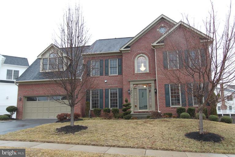 14311 Bubbling Spring Road Boyds, MD 20841 - Photo 1 of 23 a front view of a house with a yard