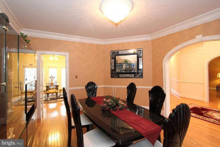 14311 Bubbling Spring Road Boyds, MD 20841 - Photo 3 of 23 a view of a dining room with furniture window and wooden floor