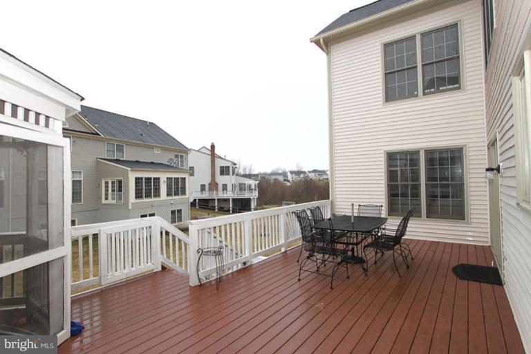 14311 Bubbling Spring Road Boyds, MD 20841 - Photo 22 of 23 a view of a house with deck and wooden floor