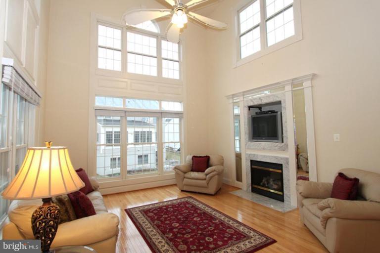 14311 Bubbling Spring Road Boyds, MD 20841 - Photo 4 of 23 a living room with furniture and a fireplace