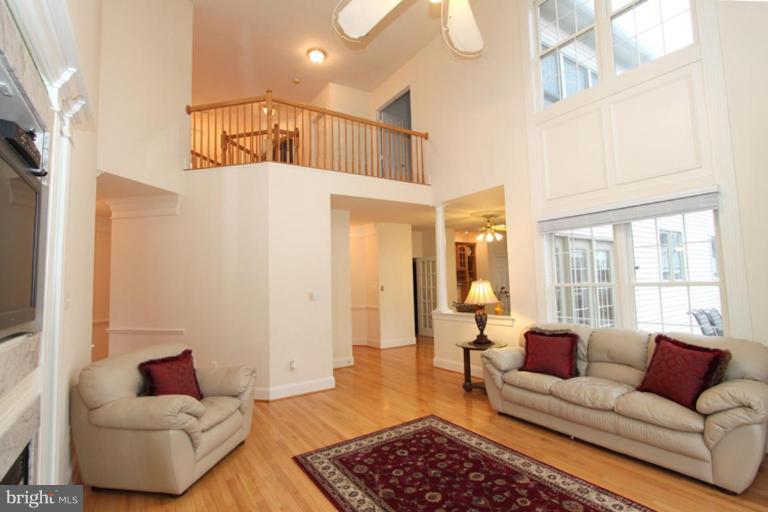 14311 Bubbling Spring Road Boyds, MD 20841 - Photo 5 of 23 a living room with furniture and a rug