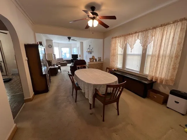 a view of a dining room with furniture window and outside view