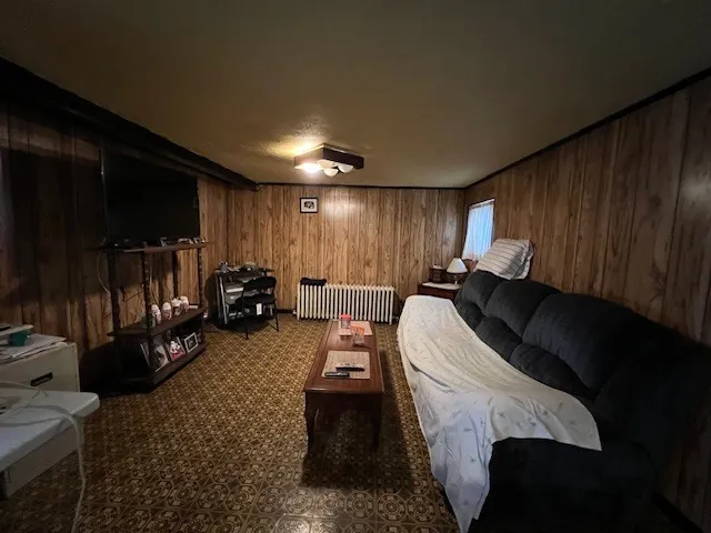 a bed room with a bed and a television