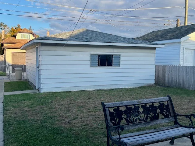 a view of a wooden chairs in backyard