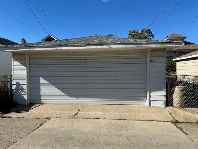 a view of a house with a window and a garage