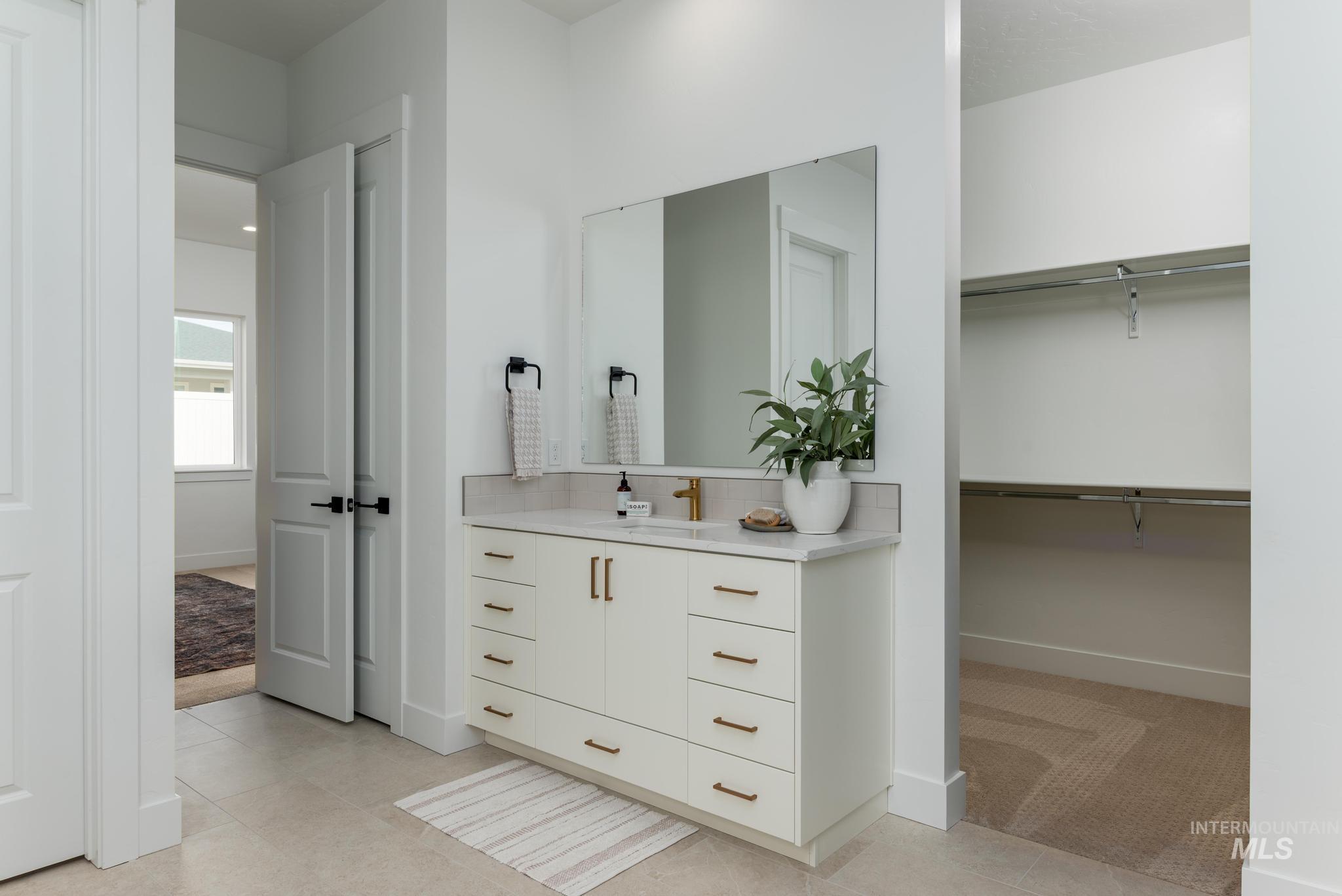 8558 South Silver Smog Way Meridian, ID 83642 - Photo 11 of 13 Full bathroom featuring vanity and light carpet
