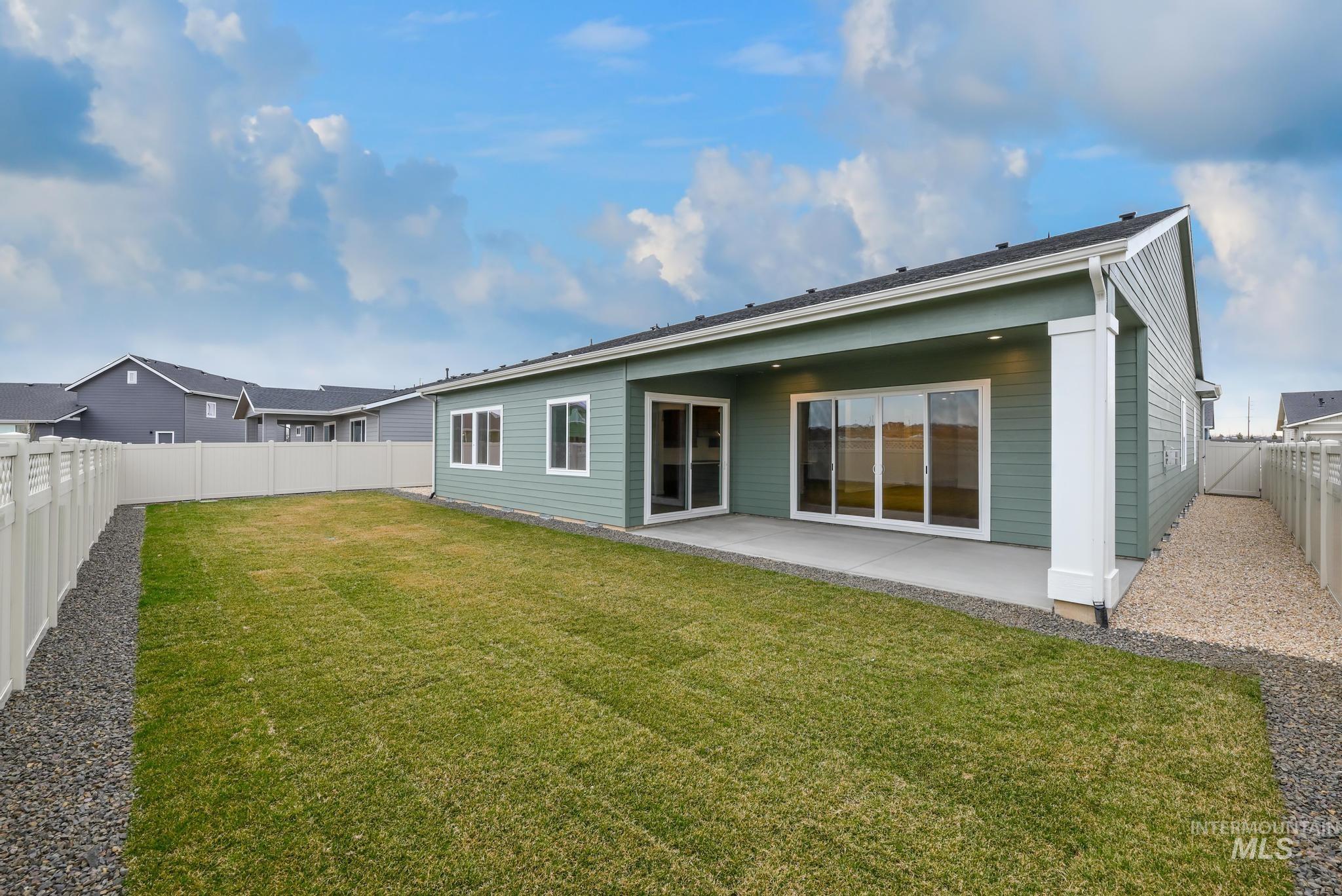 8558 South Silver Smog Way Meridian, ID 83642 - Photo 13 of 13 Back of property featuring a patio area and a fenced backyard