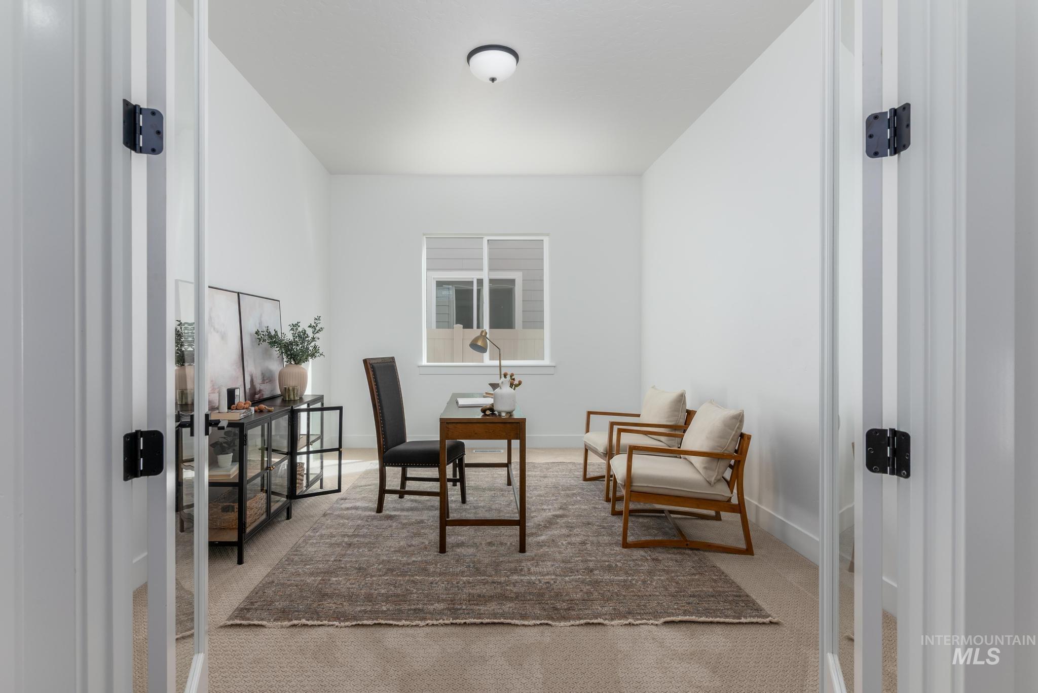 8558 South Silver Smog Way Meridian, ID 83642 - Photo 7 of 13 Living area featuring an office area and light carpet