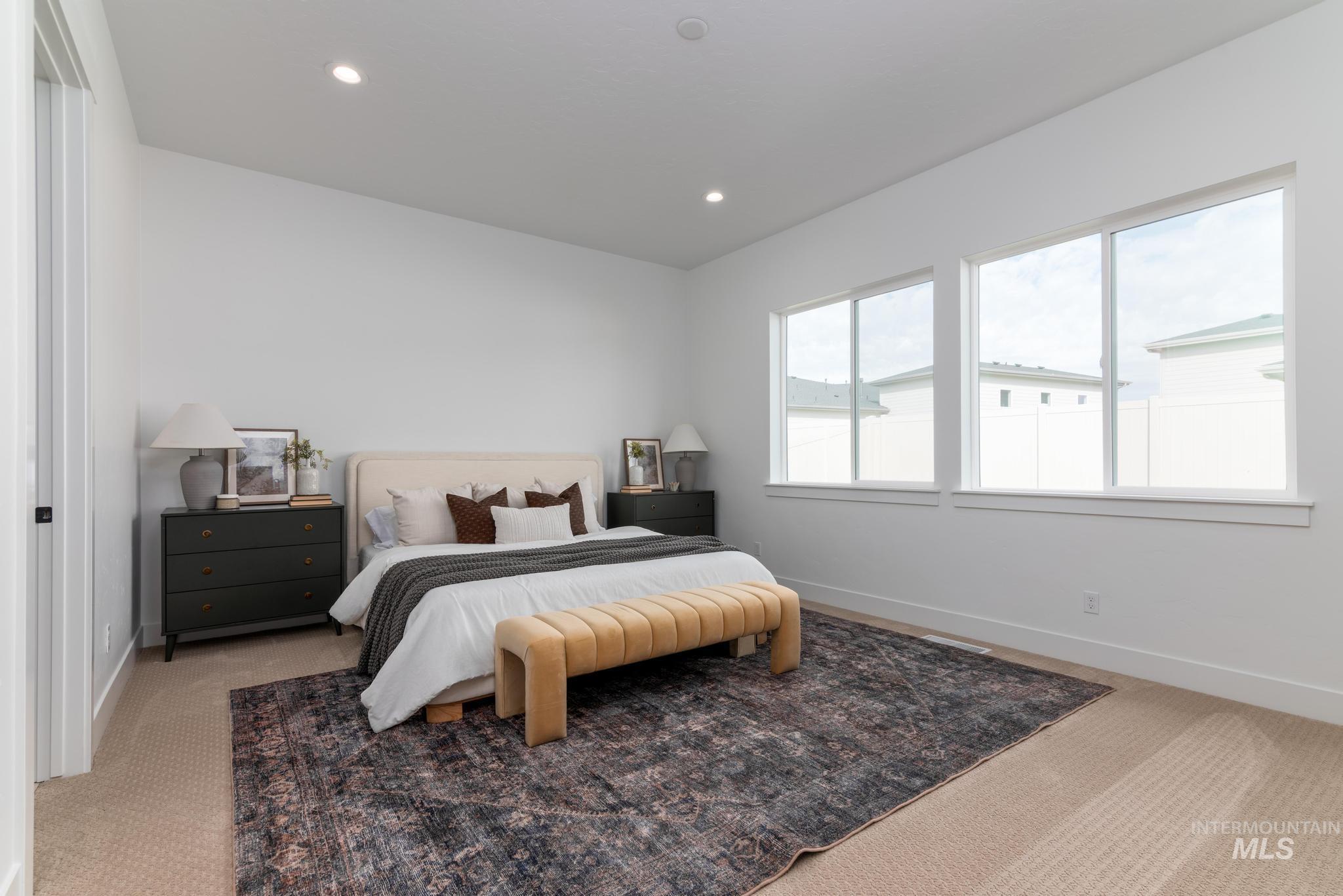 8558 South Silver Smog Way Meridian, ID 83642 - Photo 8 of 13 Carpeted bedroom featuring recessed lighting and baseboards