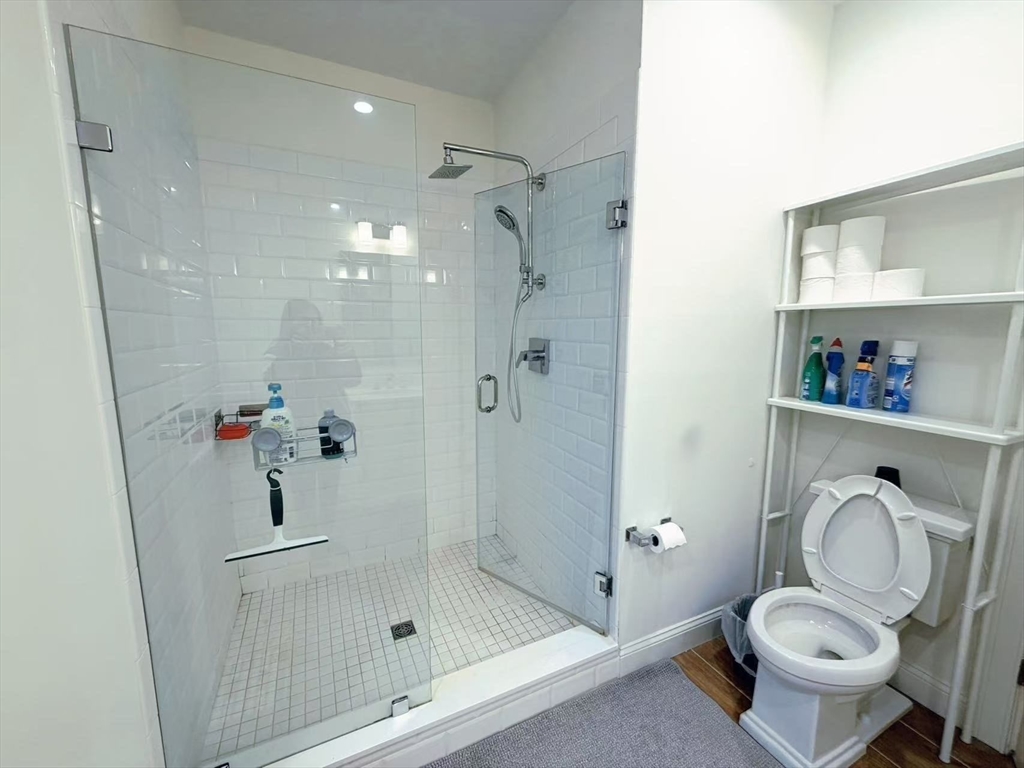 16 Taylor Drive, Unit 1010 Reading, MA 01867 - Photo 16 of 24 a bathroom with a granite countertop toilet sink and shower