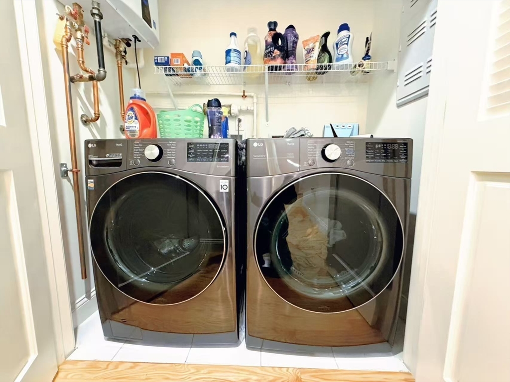16 Taylor Drive, Unit 1010 Reading, MA 01867 - Photo 19 of 24 a utility room with dryer and washer