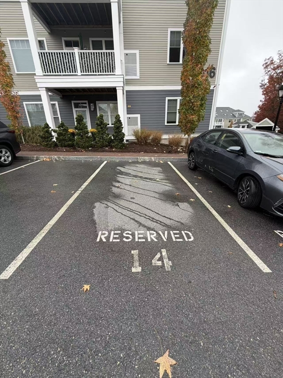 16 Taylor Drive, Unit 1010 Reading, MA 01867 - Photo 23 of 24 a front view of a building with parking space