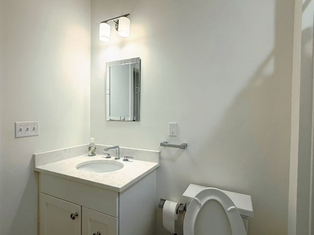 16 Taylor Drive, Unit 1010 Reading, MA 01867 - Photo 9 of 24 a bathroom with a sink vanity and mirror