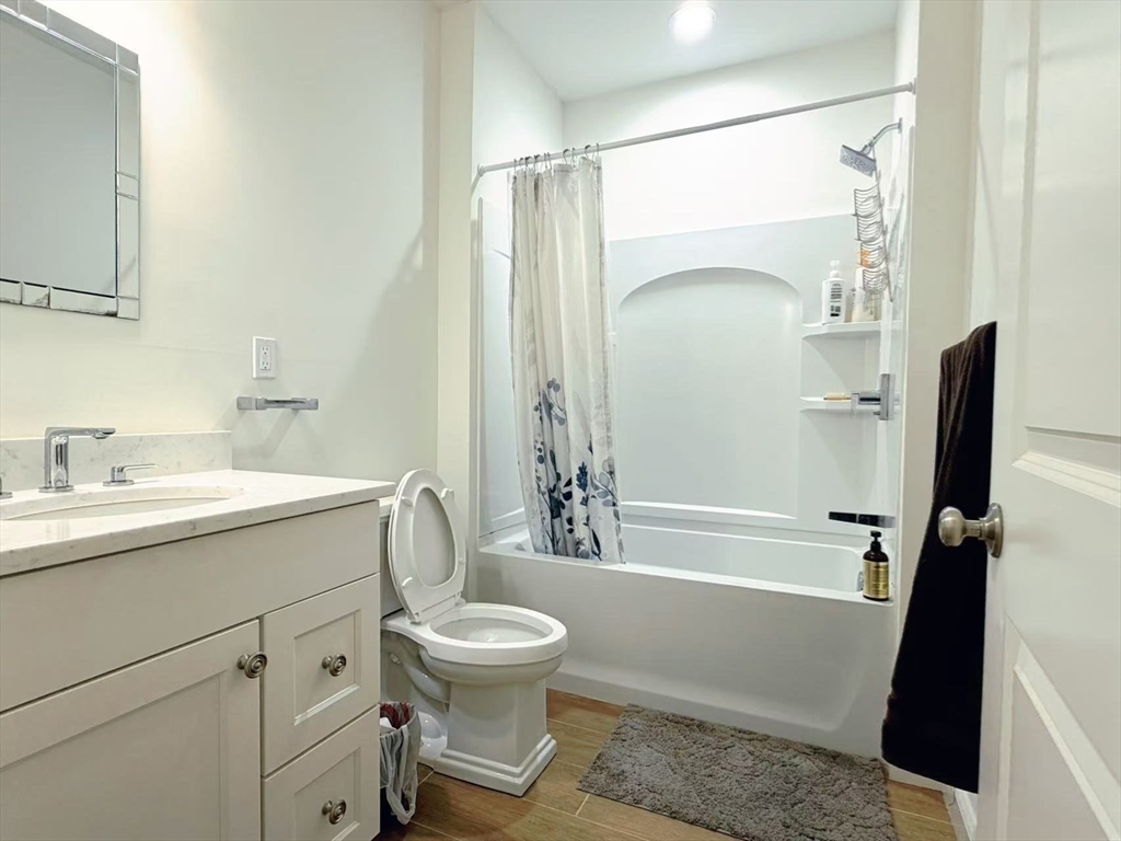 16 Taylor Drive, Unit 1010 Reading, MA 01867 - Photo 10 of 24 a bathroom with a sink a toilet and shower