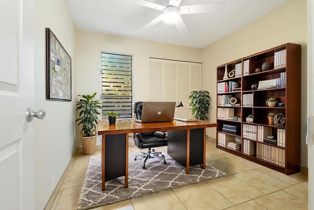 a view of a workspace with furniture
