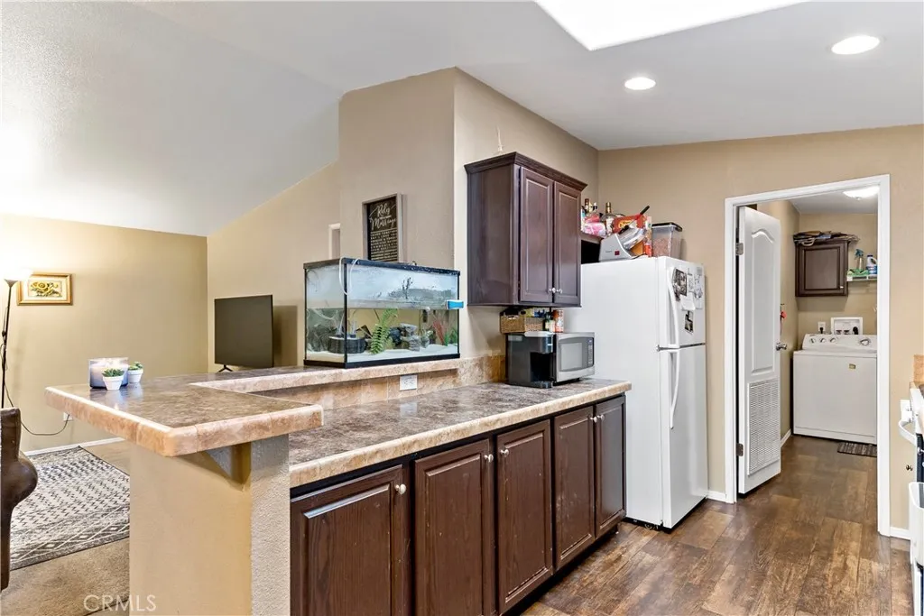 2755 Arrow La, Unit 106 La Verne, CA 91750 - Photo 11 of 28 a kitchen with stainless steel appliances a sink and a refrigerator