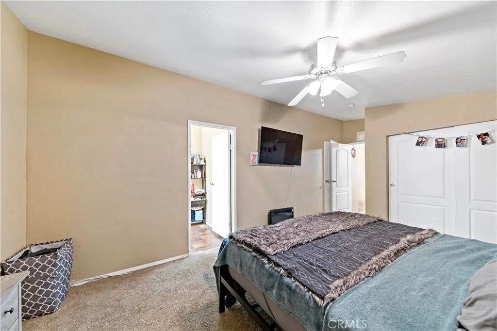 2755 Arrow La, Unit 106 La Verne, CA 91750 - Photo 15 of 28 a bedroom with a bed and a flat screen tv