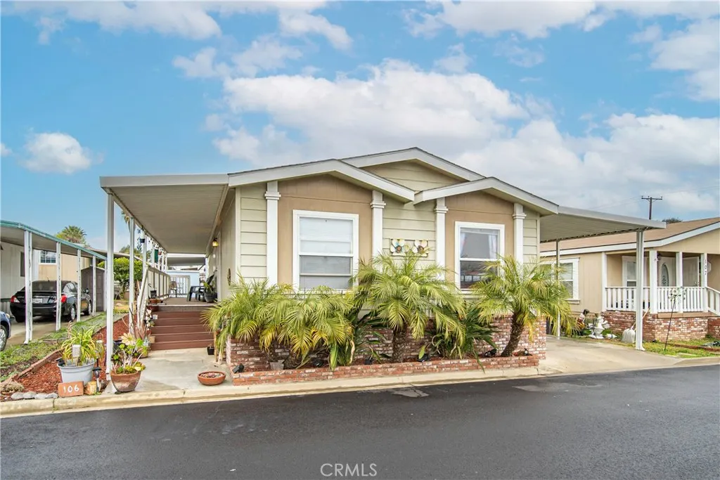 2755 Arrow La, Unit 106 La Verne, CA 91750 - Photo 2 of 28 a front view of a house with a garden