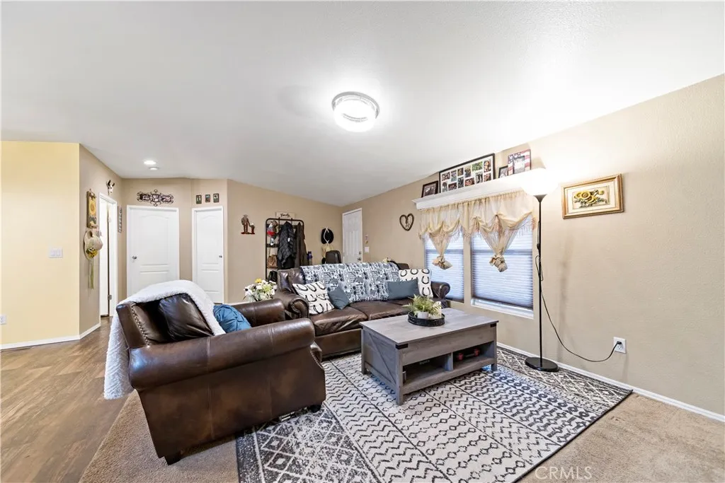 2755 Arrow La, Unit 106 La Verne, CA 91750 - Photo 4 of 28 a living room with furniture and a rug