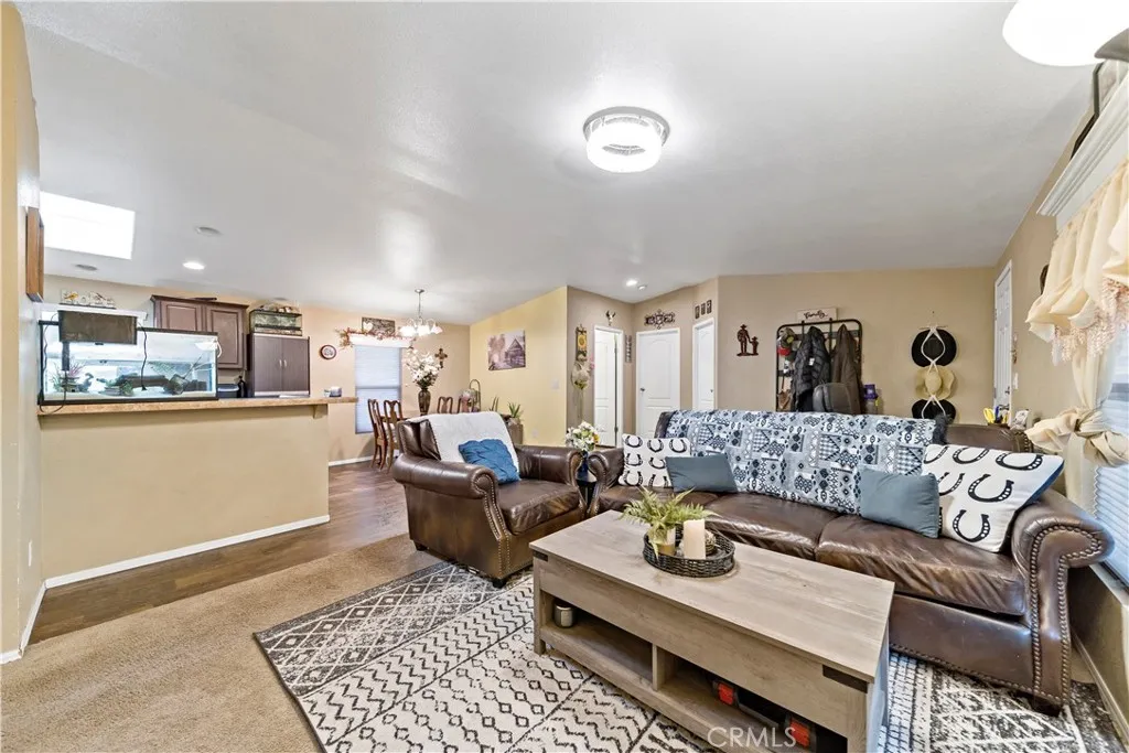 2755 Arrow La, Unit 106 La Verne, CA 91750 - Photo 5 of 28 a living room with furniture and a rug