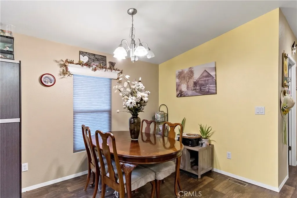 2755 Arrow La, Unit 106 La Verne, CA 91750 - Photo 7 of 28 a view of a dining room with furniture and chandelier