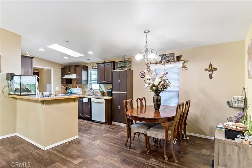 2755 Arrow La, Unit 106 La Verne, CA 91750 - Photo 8 of 28 a kitchen with a dining table chairs and refrigerator