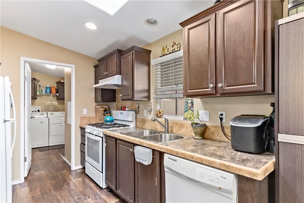 2755 Arrow La, Unit 106 La Verne, CA 91750 - Photo 10 of 28 a kitchen with stainless steel appliances granite countertop a sink stove and refrigerator