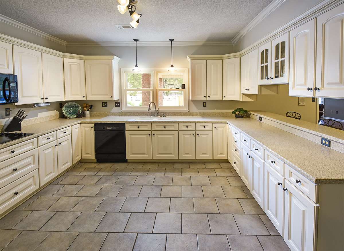 890 South Collierville Arlington Road Collierville, TN 38017 - Photo 11 of 24 This view is from the laundry room looking into the kitchen. The kitchen window overlooks a grassy area into one of the pastures near the barn. Solid surface counters, lots & lots of cabinet storage, double deep sinks, new lighting & fixtures.
