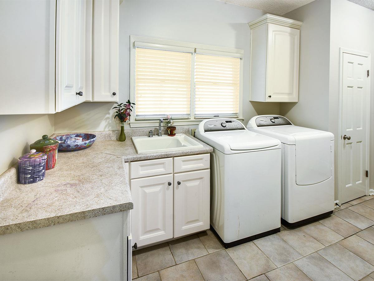890 South Collierville Arlington Road Collierville, TN 38017 - Photo 14 of 24 Counter & Cabinet storage, this area has room for another fridge and faces the front of the home off the kitchen.