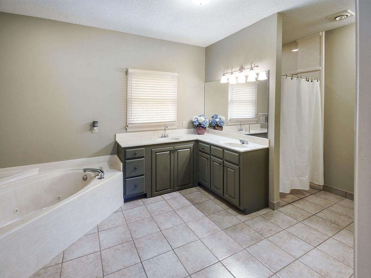 890 South Collierville Arlington Road Collierville, TN 38017 - Photo 20 of 24 The design of this bathroom was done with wheelchair access directly into the shower and ability to get closer to a sink.