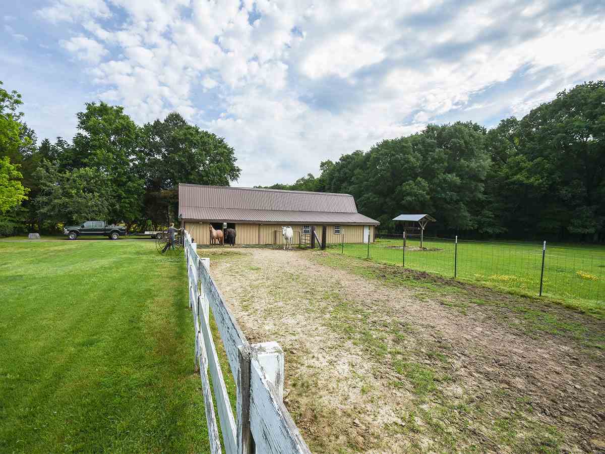 890 South Collierville Arlington Road Collierville, TN 38017 - Photo 3 of 24 The barn consists of 4 stalls, 2 (single) garage parking doors or if needed plenty of room for a work shop. There is a pull up garage sized door for equipment storage etc. Barn is equipped with water & electricity.