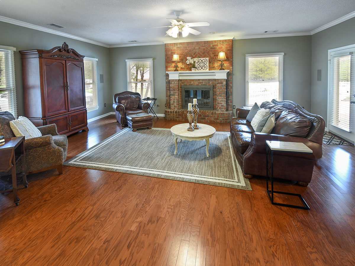 890 South Collierville Arlington Road Collierville, TN 38017 - Photo 9 of 24 Upon entering 2nd entry hall (slate tile) from the back of the home, this large great room offers 1 of 2 fireplaces. This is the heart of the home and offers views of the pasture, barn, pool & additional treed acreage.