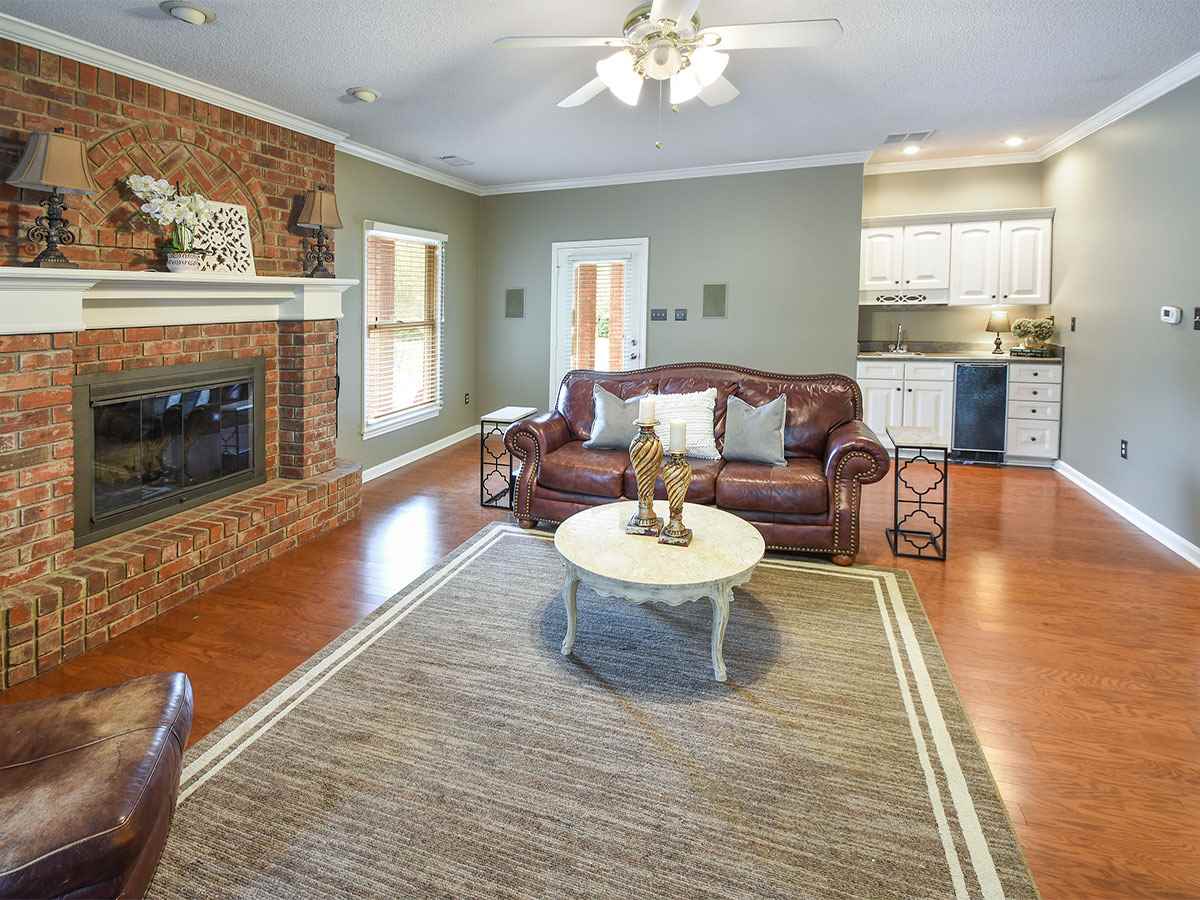 890 South Collierville Arlington Road Collierville, TN 38017 - Photo 10 of 24 Entertainment area would not be complete without a wet bar included. This room measures 23 x 19 and door as shown leads to covered patio & pool.