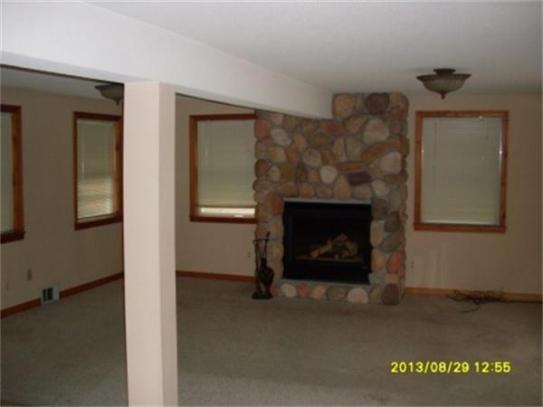 730 N Road Westfield, MA 01085 - Photo 5 of 10 a living room with furniture and a fireplace