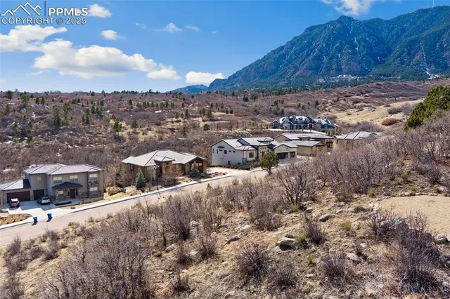 a view of a large mountain with a mountain in the background