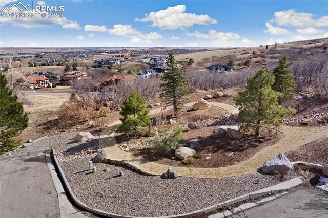 a view of a backyard of the house