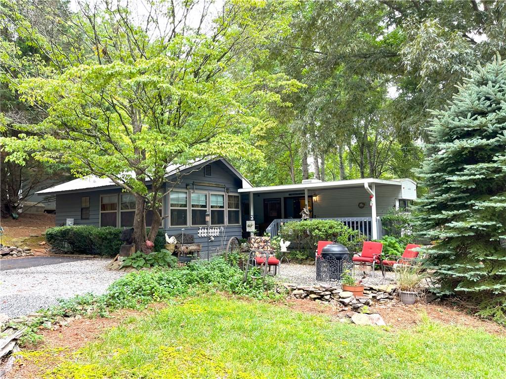 a front view of a house with an outdoor seating