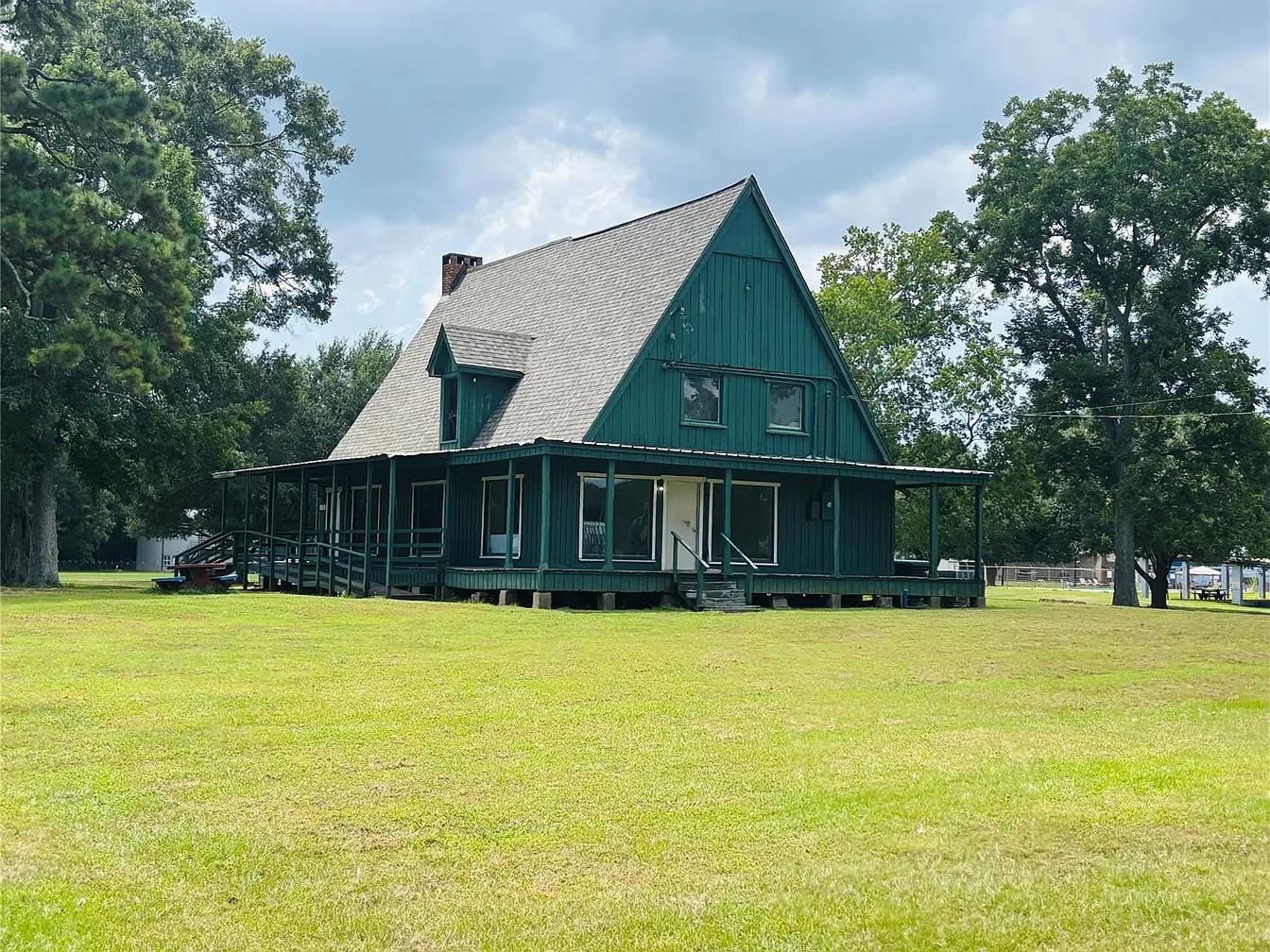 101 Vickie Lane Shepherd, TX 77371 - Photo 25 of 29 a view of a house with swimming pool and a yard