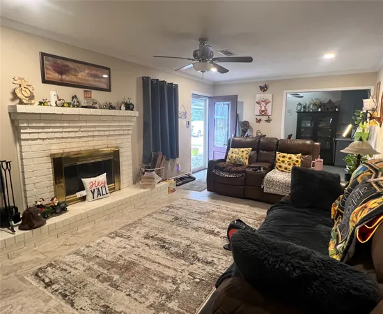 a living room with furniture and a fireplace