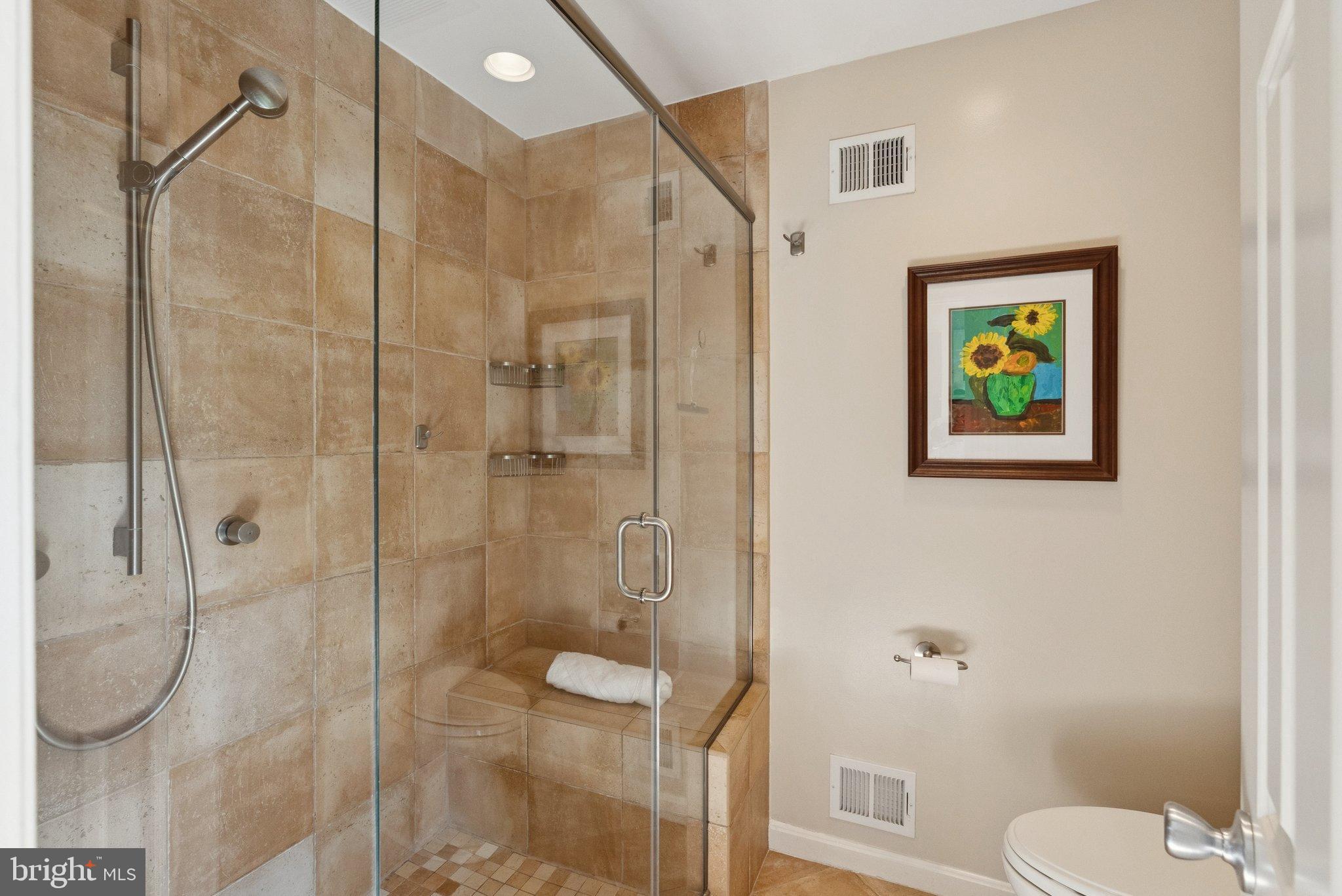 9817 Conestoga Way Potomac, MD 20854 - Photo 21 of 35 a bathroom with a shower and toilet