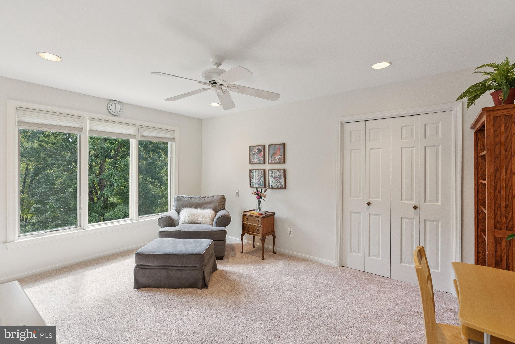 9817 Conestoga Way Potomac, MD 20854 - Photo 24 of 35 a living room with furniture and a large window