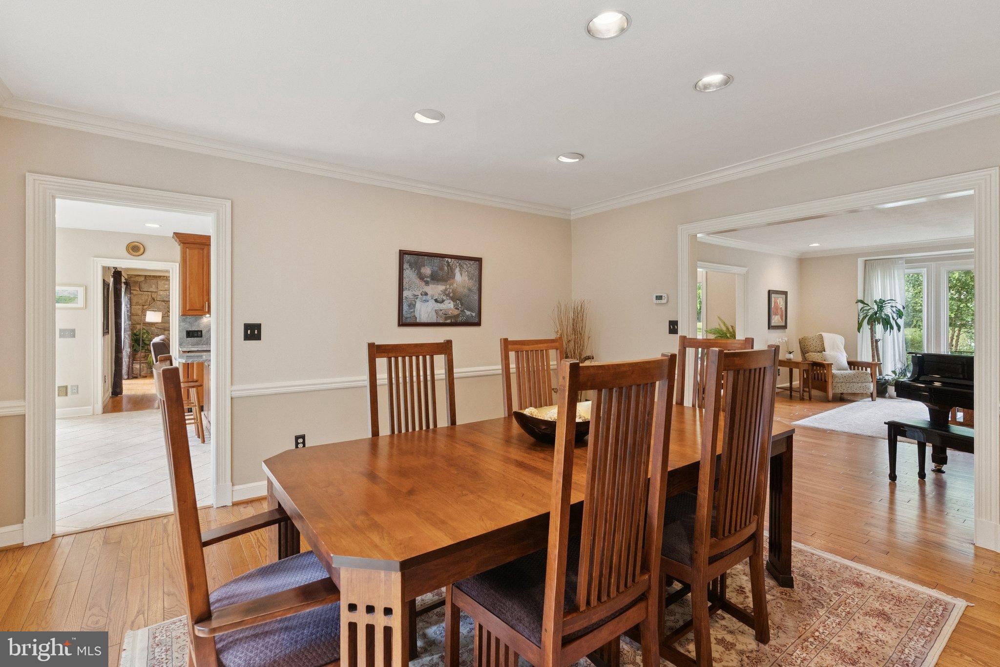 9817 Conestoga Way Potomac, MD 20854 - Photo 4 of 35 a view of a dining room with furniture and wooden floor