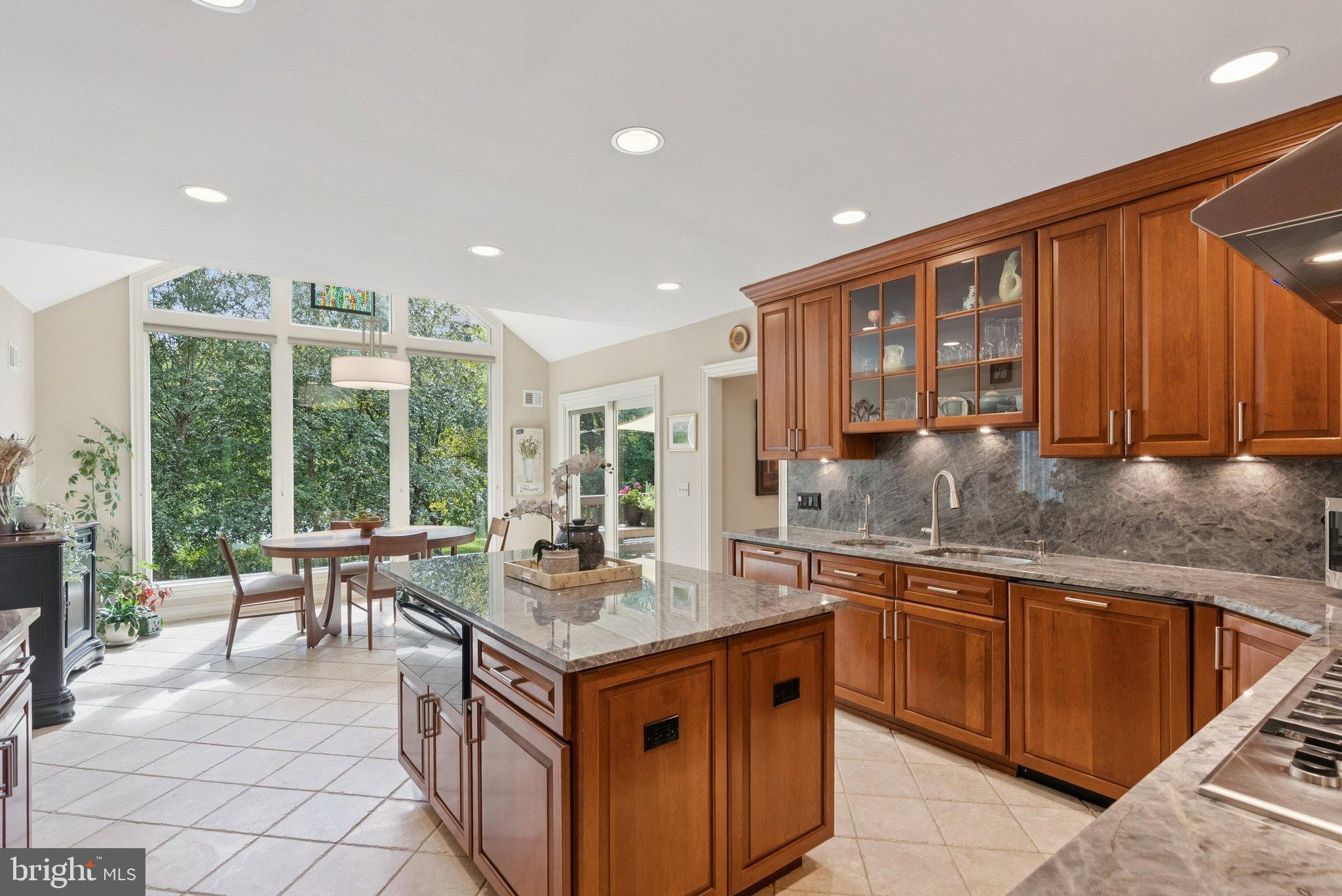 9817 Conestoga Way Potomac, MD 20854 - Photo 8 of 35 a kitchen with a stove sink and cabinets