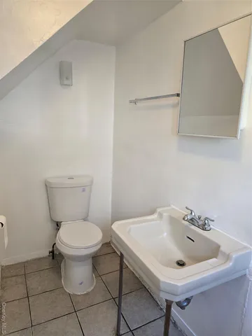 a bathroom with a sink and toilet