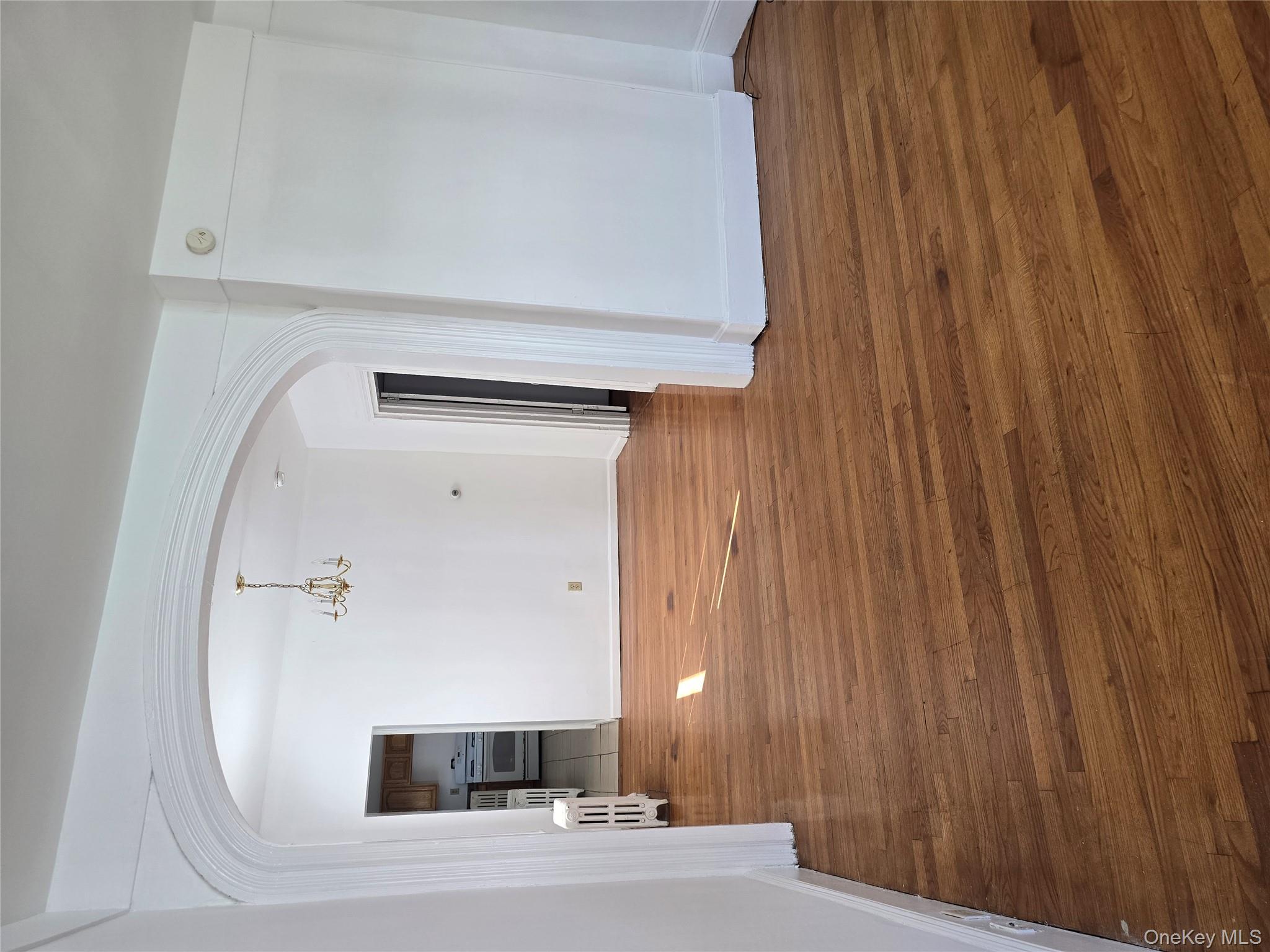 19 Elizabeth Street, Unit 1 Port Jervis, NY 12771 - Photo 4 of 16 a view of an empty room with wooden floor