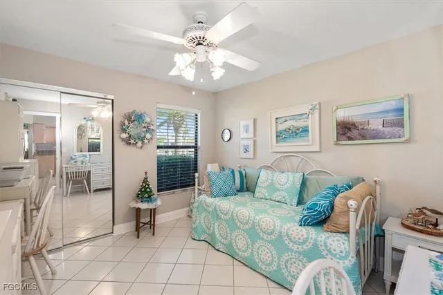 a living room with furniture and chandelier