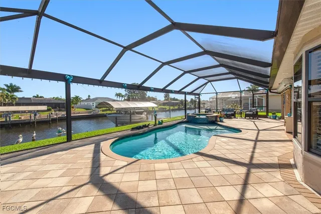 a view of a swimming pool with a patio